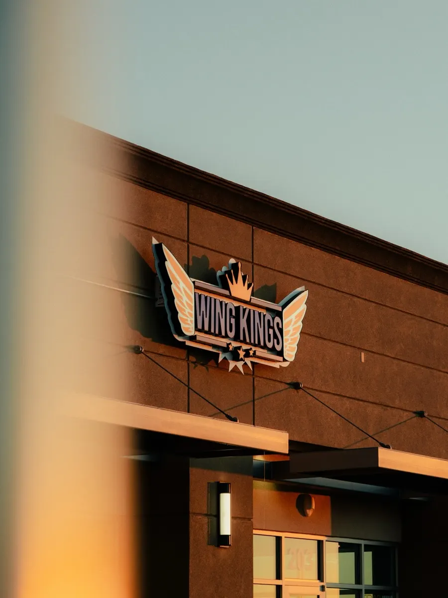 The winged Wing Kings crown sign on the storefront